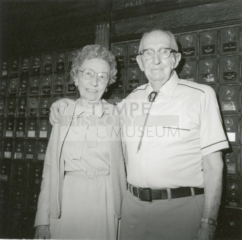 Unidentified Couple Standing By Old Post Office Boxes