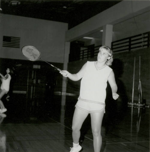 Unidentified Woman Practicing With Racket in Gym - (1 of 3)