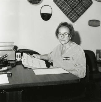 Uknown Woman Seated at a Desk