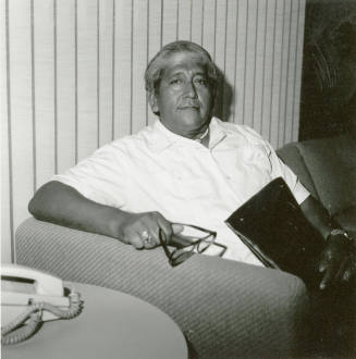 Unidentified Man Seated on a Couch