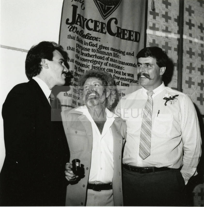 Unidentified Group of 3 Men Stand by Jaycee Creed Banner
