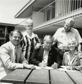 Unidentified Group of 3 Men & 2 Women Signing Papers