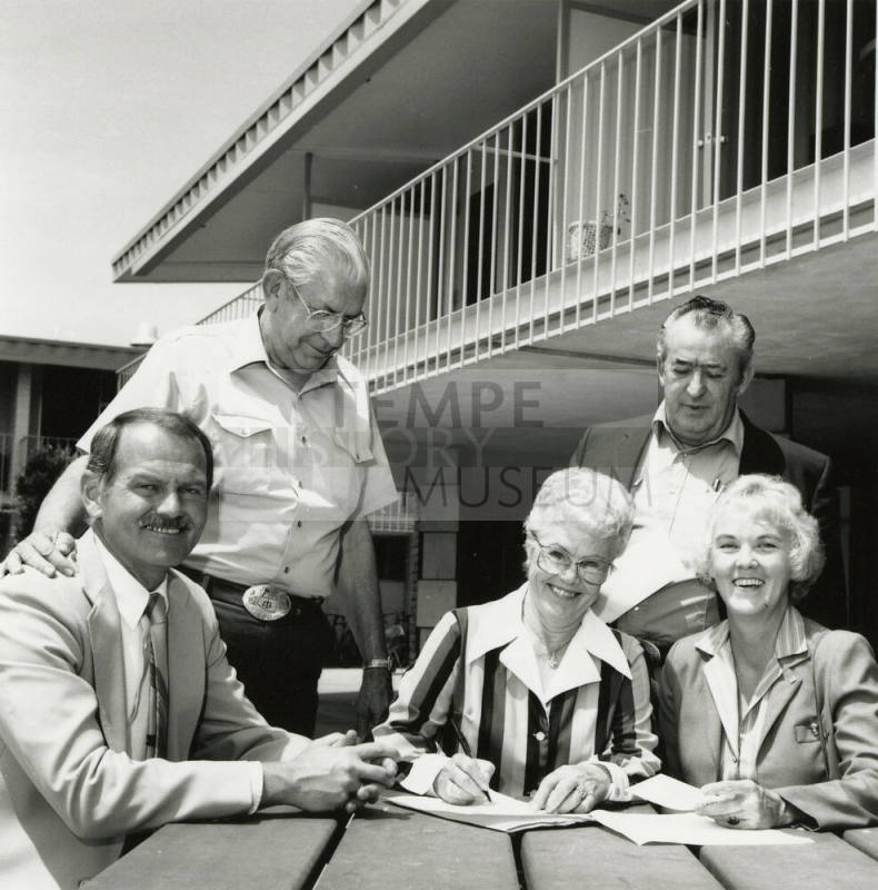 Unidentified Group of 3 Men & 2 Women Signing Papers