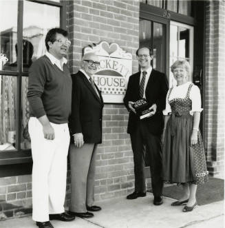 David Eisenhower Dick Neuheisel, Howard Pyle, and Jane Neuheisel, standing in front of Hackett House, Sister City Oktoberfest