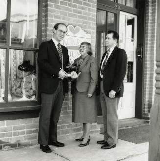 David Eisenhower and a couple, standing in front of Hackett House, Sister City Oktoberfest