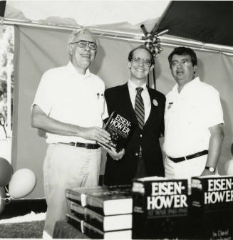 David Eisenhower and two men at a book signing, Sister City Oktoberfest