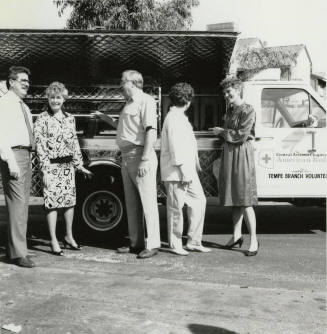 Group Stands in Front of American Red Cross Truck