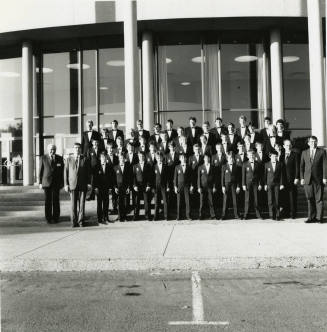 Unidentified boys' and men's choir pose for a photograph outside of Gammage Auditorium at ASU Tempe Campus