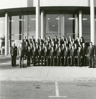 Unidentified boys' and men's choir pose for a photograph outside of Gammage Auditorium at ASU Tempe Campus