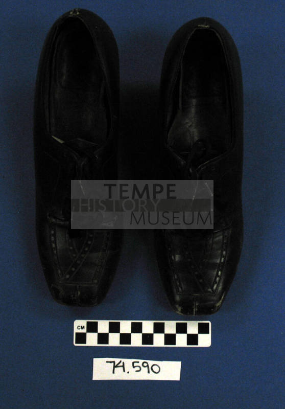 Pair of black ladies' lace-up shoes