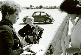 Jan Young, her VW bug, and two models.