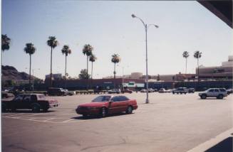 Color print of Tempe Center stores and parking lot, looking east