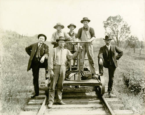 Railway track workers with Hand Car on track