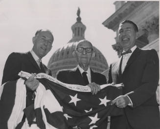 Carl Hayden photographed between being Senator Paul Fannin, left, and U.S. Representative Mo Udall, right, near capitol building, Washington D.C.
