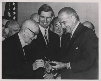 Group of Men with L. B. Johnson giving a Pen to Hayden