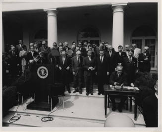 Lyndon B. Johnson signing a Bill