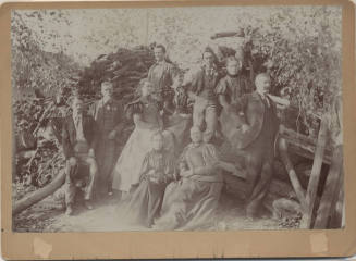 Johnson Family Photo infront of "Grandma Broomell's Wood Pile"
