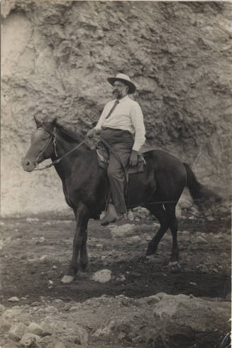 Dr. Fenn Hart Riding a Dark Horse
