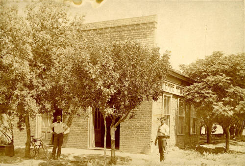 Curt Miller and Chris Sigala standing in front of the Tempe News building