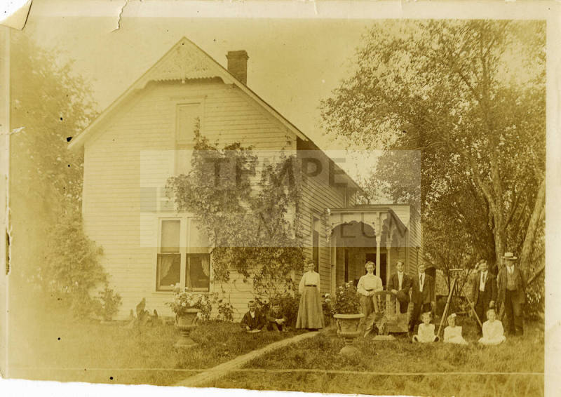 Family portrait of Cushman family outside their home in Ohio.