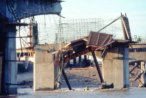 Closeup of bridge pier and framework destruction.