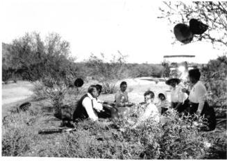 Image of a picnic in the desert with the Woolf family