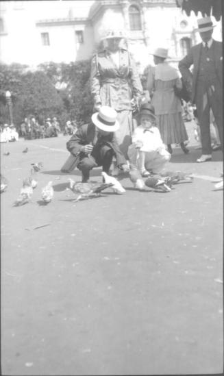 Charles Howard and Dorothy feeding pigeons