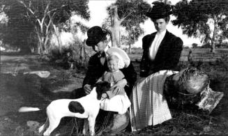 Charles Custis, Ruby, and Charles Harold with dog