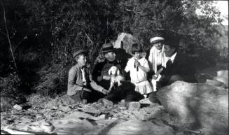 Charles Custis holding a lamb, Charles Harold, Dorothy, and 2 unknown people