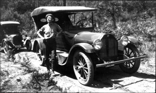 Charles Custis Woolf with 1927 Ford automobile
