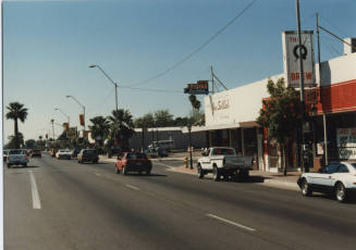 Photograph - Joe Selleh Sporting Goods Store and The Q & Brew on 7th St and Mill