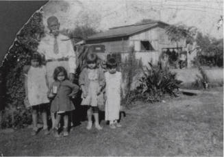 Photograph - Jesus E. Gomez with his grandchildren