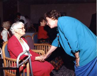 Photograph - Jessie Fisk shaking hands with Ann from Governer's office