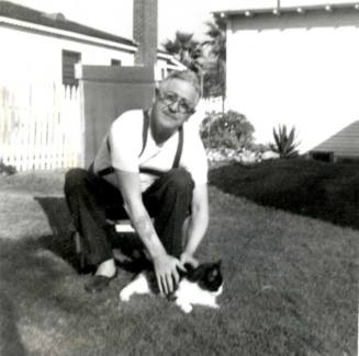 Man with Cat in Lawn