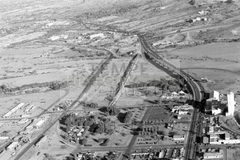 Aerial view looking north across Salt River with the Mill Avenue, Ash Avenue, and Southern Pacific Railroad Bridges, and Hayden Flour Mill