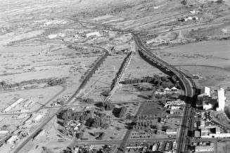 Aerial view looking north across Salt River with the Mill Avenue, Ash Avenue, and Southern Pacific Railroad Bridges, and Hayden Flour Mill