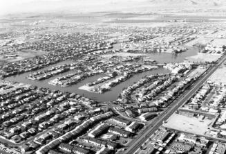 Aerial view of The Lakes residential area of Tempe, Arizona looking southwest. Baseline Road runs from bottom center to upper right.