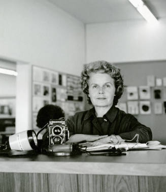 Tempe Daily News photographer Jan Young with a camera