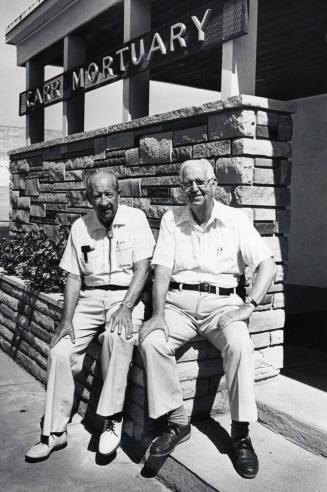Picture of the Carr Brothers seated at the Front of the Carr Mortuary