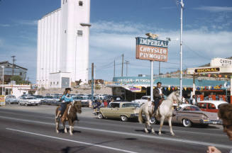 Gilbert Gonzales Riding a Horse in Arizona State University Homecoming Parade 1958