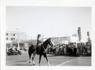 Young Woman on Horseback in Parade