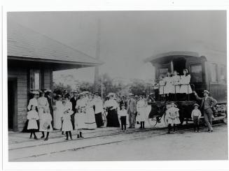 Group of people at Mesa train station.