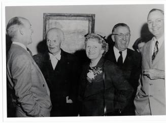 Group of four men and a woman