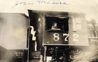 Josie Madera in a train engine window at the Phoenix Round House