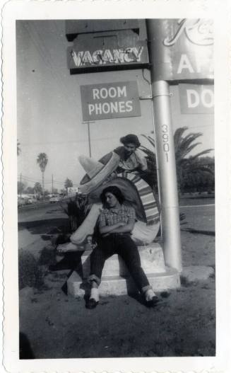 Annie Gomez and Katy Ramirez at Van Buren motel sign
