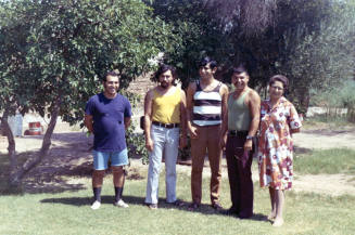 Irene Elias-Rodriguez with four young men