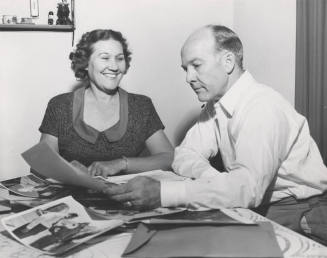 Howard and Lucile Pyle Looking at Photos