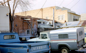 Vehicles parked in Alley East of Mill Ave.