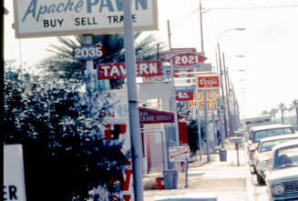 Signs on 2000 block of Apache Blvd.