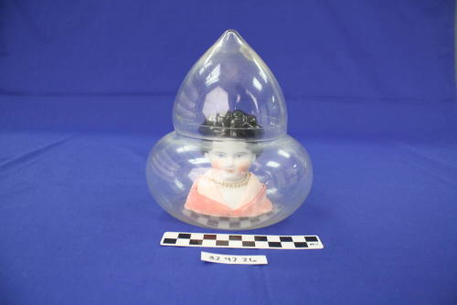 Doll Head In Glass Case